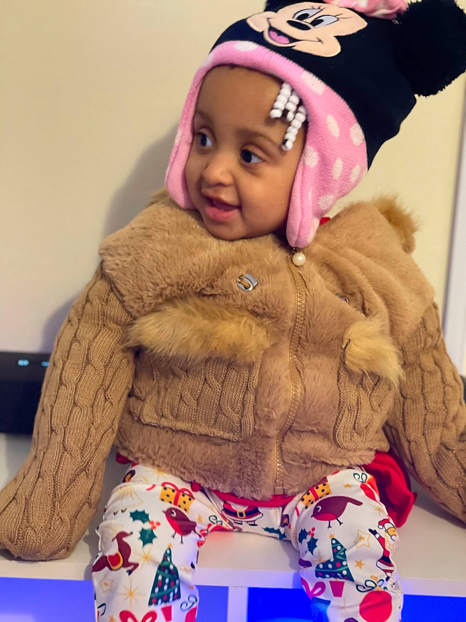 Storm Denise joined the competition — help win amazing prizes! active_pants, baby, baby_laughing, baby_toddler_clothing, bonnet, child, child_model, cool, costume_accessory, headgear, headwear, hood, nightwear, pajamas, person, pink, sleeve, textile, toddler