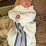 newborn, baby, infant, swaddled, blanket, hat, sleeping, person, arms, plaid, fabric, striped, hospital, comfort, cozy, indoor, clothing, resting, tender, peaceful