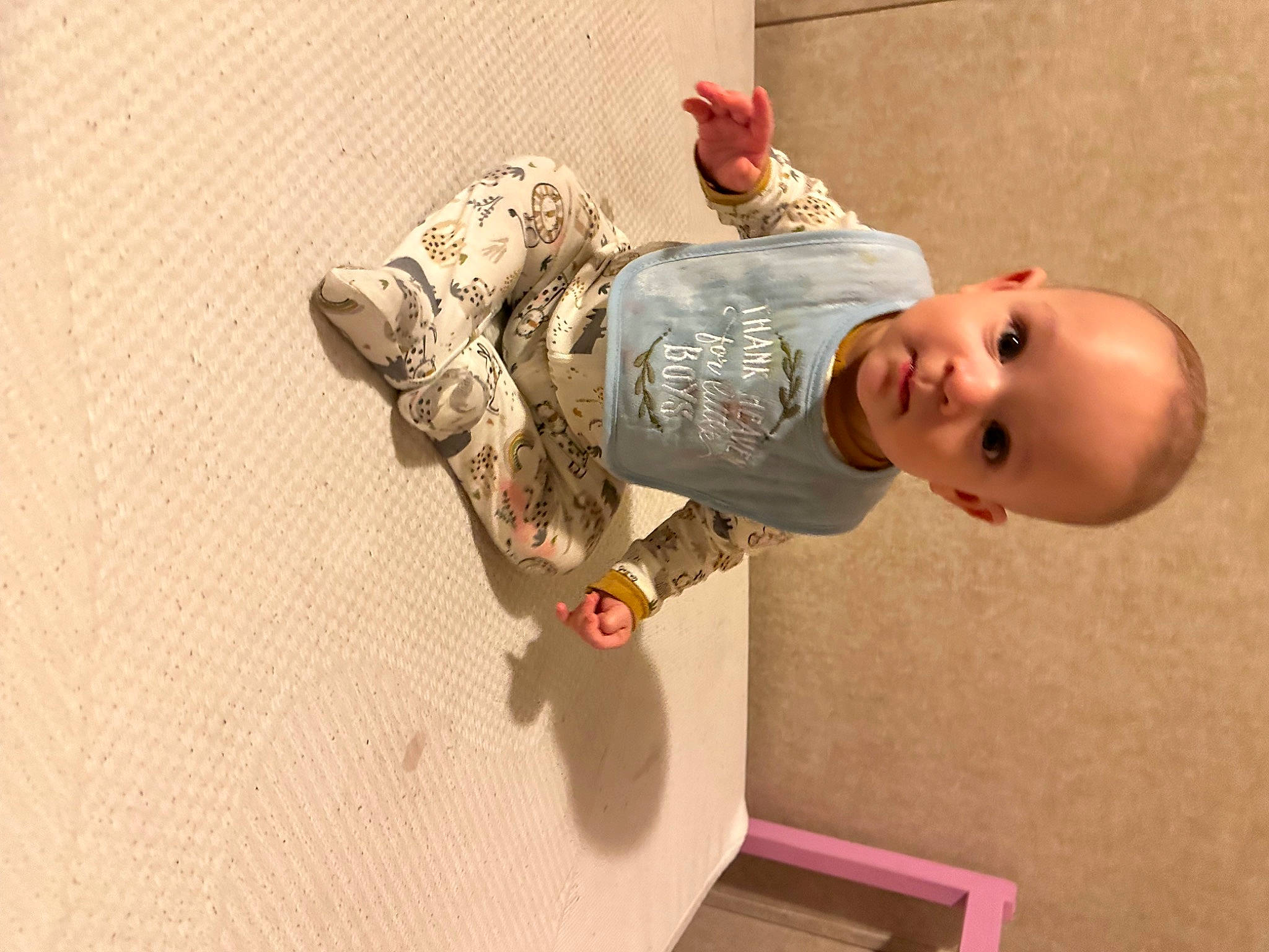 Finnegan is registered to the contest to win money with this photo: arm, baby, baby_toys, child, elbow, flooring, fun, happy, hat, person, room, smile, toddler, toy, wood