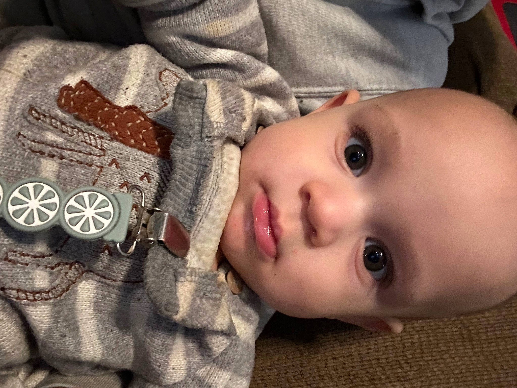 Finnegan is registered to the contest to win money with this photo: baby, cheek, chin, cool, eye, eyebrow, eyelash, face, facial_expression, flash_photography, head, human, iris, lip, mouth, nose, person, skin, sleeve, toddler