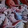 Hunter Wright is registered to the contest to win money with this photo: baby, baby_seat, blanket, blue, child, comfort, cozy, cushion, cute, face, indoors, infant, nasal_aspirator, newborn, patterned_blanket, peaceful, pink, resting, sleeping, soft_toy