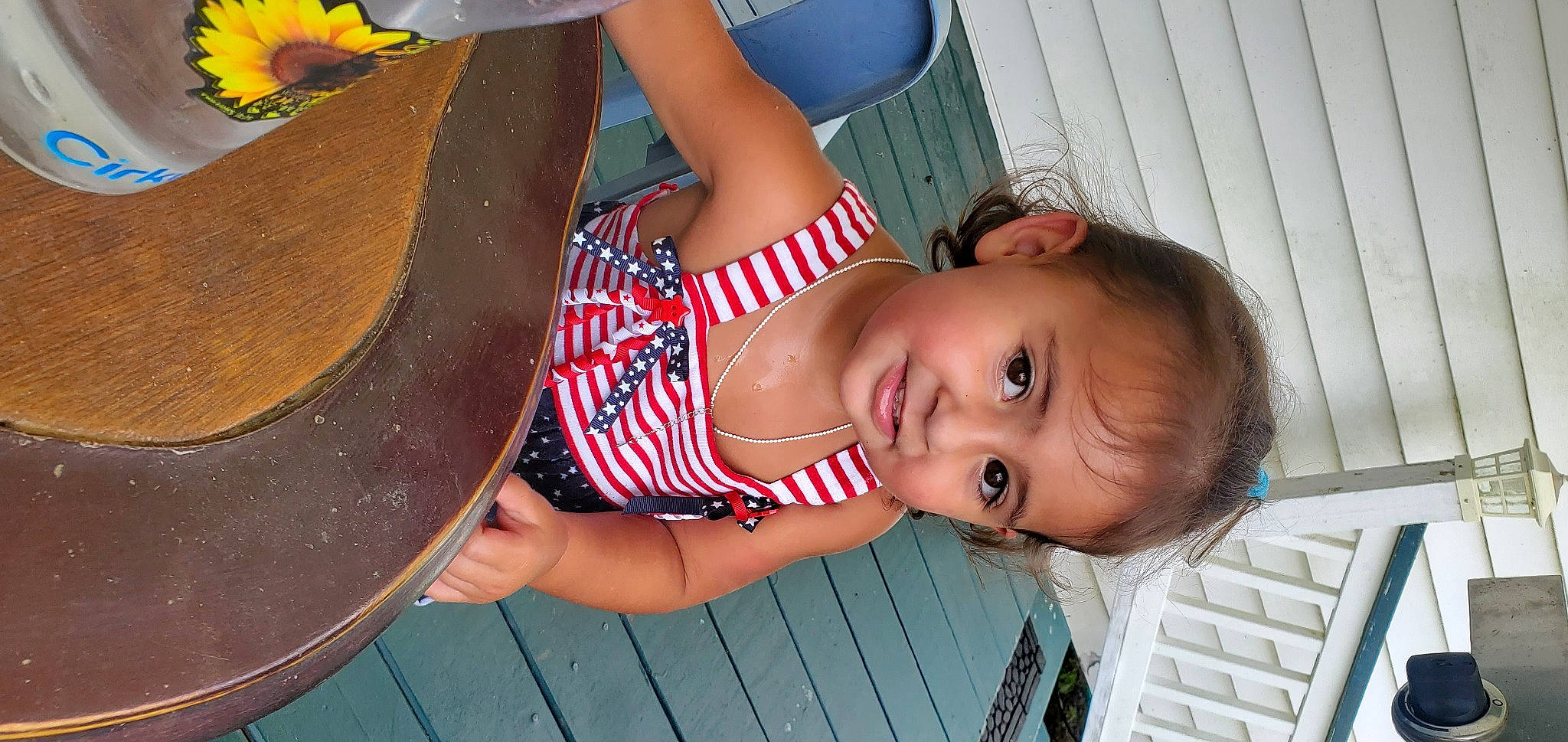 Harpar is registered to the contest to win money with this photo: baby, baby_toddler_clothing, chest, dress, drum, eyewear, fun, happy, human_leg, leisure, lip, mouth, musical_instrument, nose, person, skin, sunglasses, thigh, toddler, wood