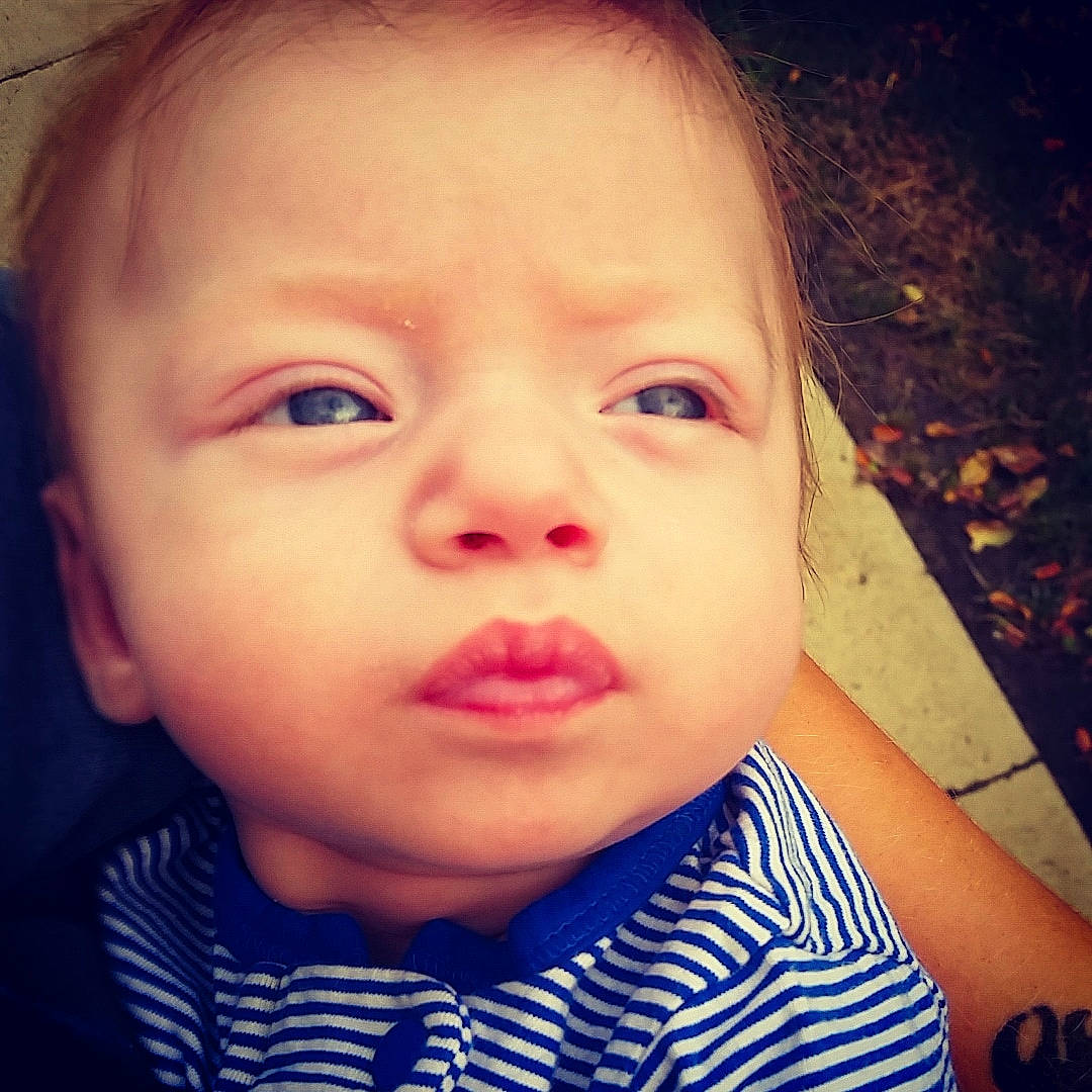 Neil is registered to the contest to win money with this photo: baby, beauty, cheek, child, chin, close_up, cool, eye, eyebrow, face, forehead, hair, head, iris, lip, nose, organ, person, skin, sky