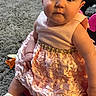 Semaj is registered to the contest to win money with this photo: baby, child, pink_dress, ruffles, carpet, indoor, sitting, cute, face, person, sock, footwear, floor, home, soft_lighting, curious, young, portrait, adorable, fashion