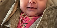 Ava is registered to the contest to win money with this photo: baby, car_seat, child, closeup, cute, expression, fabric, face, floral_pattern, happy, harness, head, indoors, infant, person, pink_clothing, seat_belt, skin, smile, young
