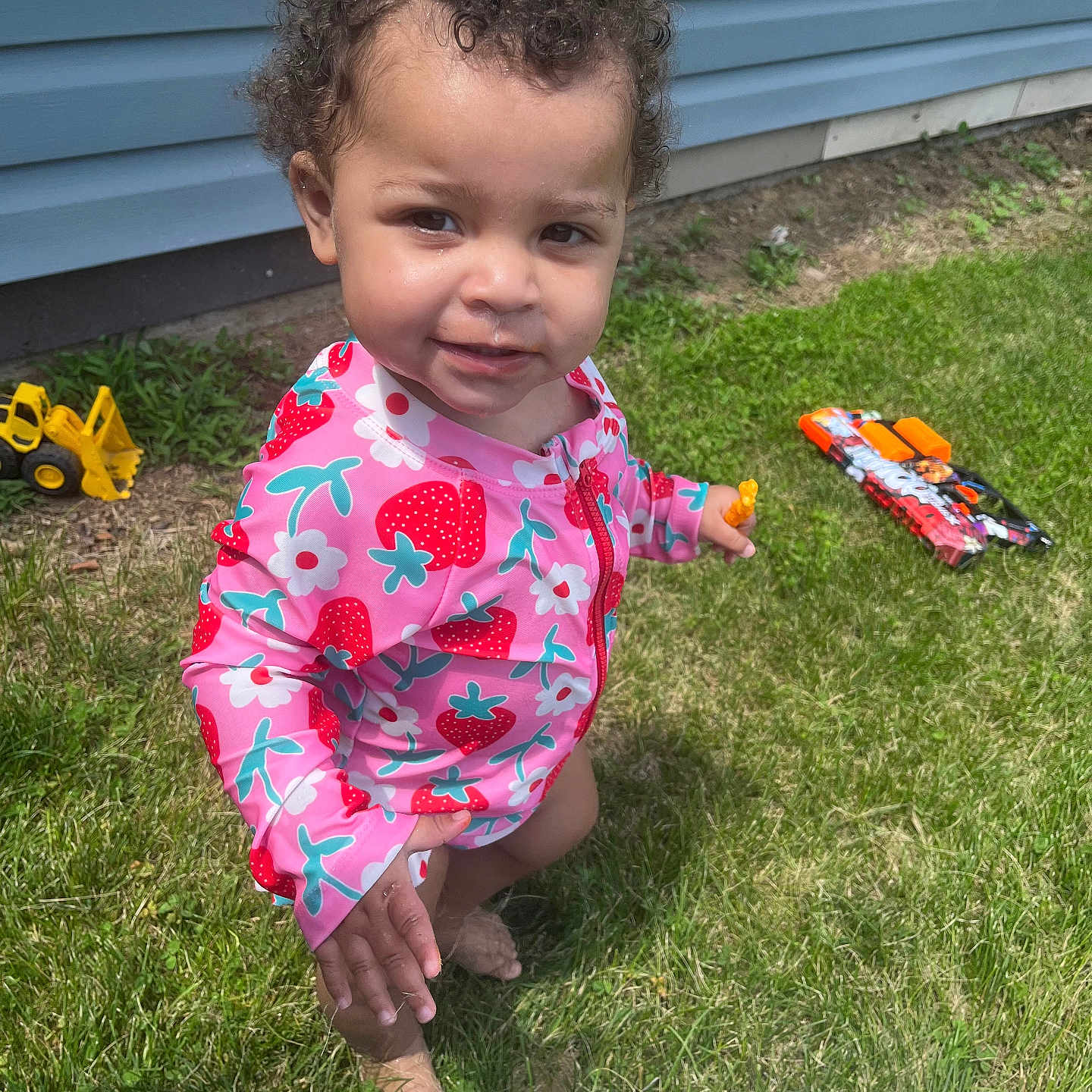 Kalani joined the competition — help win amazing prizes! baby, backyard, clothing, dress, face, food, grass, head, lawn, machine, nature, outdoors, person, photography, plant, portrait, summer, sweets, wheel, yard