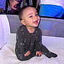 Colton joined the competition — help win amazing prizes! baby, child, onesie, playpen, smiling, happy, indoor, clothing, person, sitting, fabric, arm, hand, furniture, bedroom, mesh, adult, watch, casual, portrait