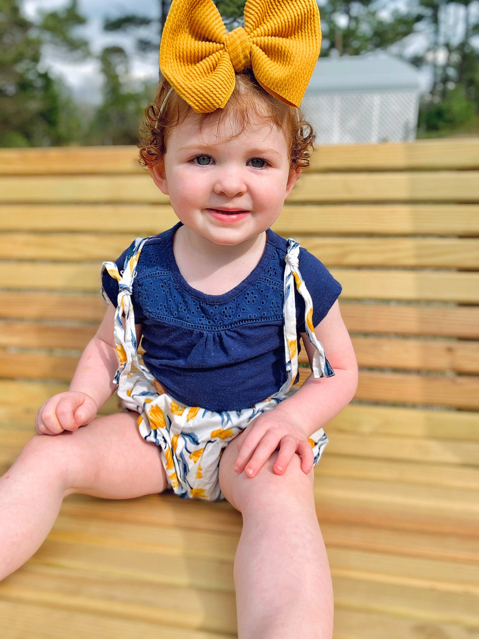 Adley is registered to the contest to win money with this photo: baby, baby_toddler_clothing, blue, child, chin, costume_hat, electric_blue, fashion_accessory, happy, human_leg, joy, knee, orange, pattern, person, skin, sleeve, smile, thigh, toddler