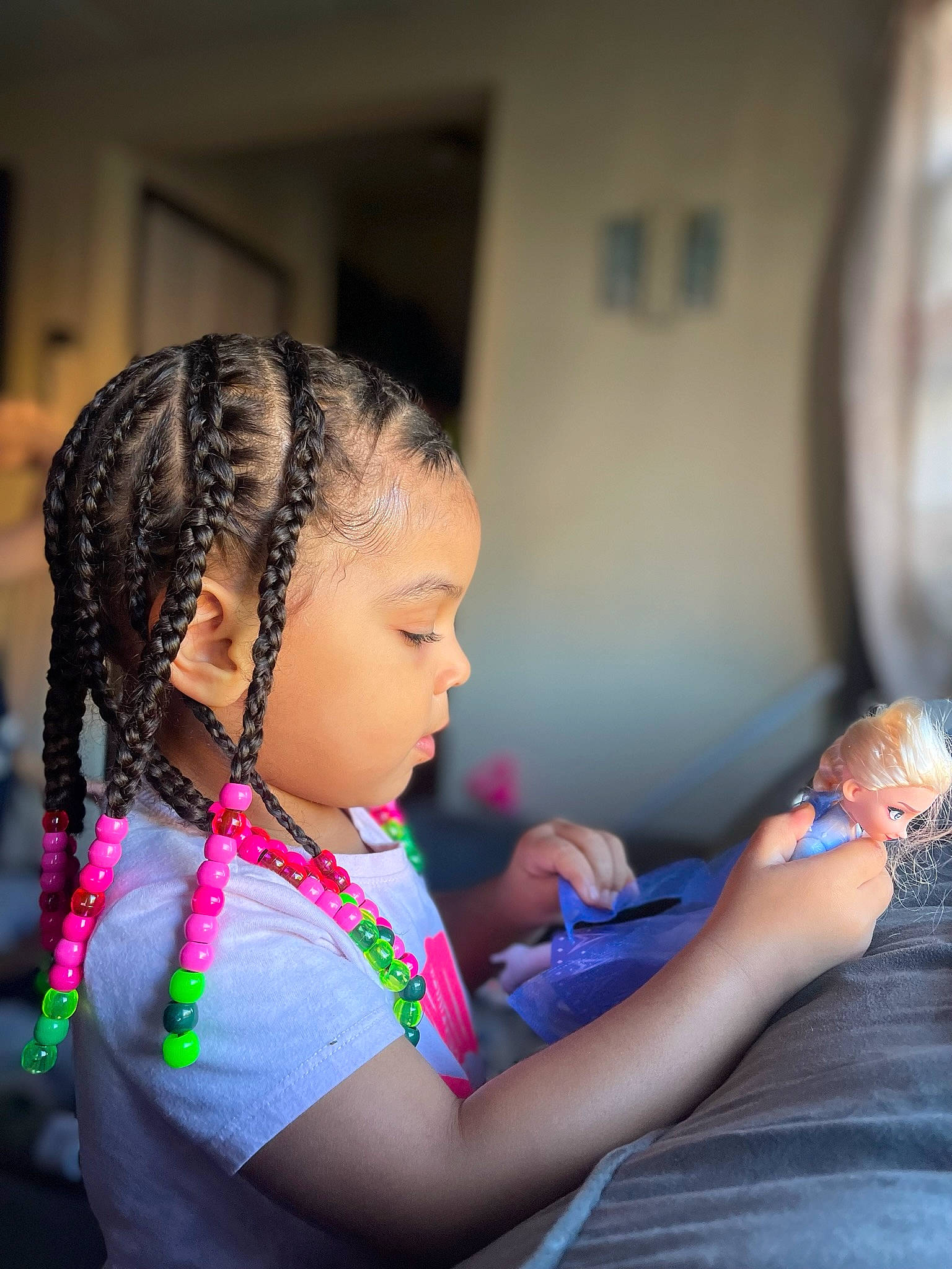 Azrielle joined the competition — help win amazing prizes! audio_equipment, braid, child, cornrows, dreadlocks, event, fashion_design, flash_photography, fun, happy, jewellery, leisure, necklace, person, sitting, toddler