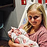 Daisy joined the competition — help win amazing prizes! baby, bed, child, cute, family, floral_clothing, girl, healthcare, holding, hospital, indoor, love, newborn, parenting, person, pink_bow, portrait, sibling, smile, tender