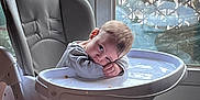 Louca participe au concours pour gagner de l'argent avec cette photo : baby, child, cozy, curtain, daylight, expression, floor, foot, furniture, high_chair, home, indoor, person, relaxing, resting, seat, sleepy, toddler, tray, window