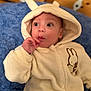 Louca a rejoint le concours — aidez-le/la à gagner de superbes lots ! baby, blue_cushion, bunny_ears, casual, child, clothing, cozy, cute, expression, eyes, face, hand, hoodie, indoor, infant, person, portrait, soft_fabric, warm, wooden_background