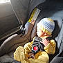 baby, car_interior, car_seat, child, child_safety, crocheted_hat, cute, fabric, headwear, infant, interior, pacifier, resting, seatbelt, sitting, small_hand, soft_light, sunlight, window, yellow_clothing
