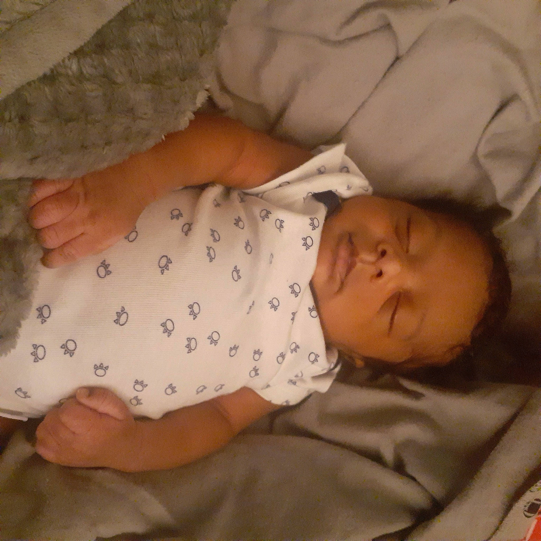 Dontrice joined the competition — help win amazing prizes! baby, baby_sleeping, baby_toddler_clothing, cheek, child, comfort, facial_expression, finger, gesture, hand, linens, mouth, pattern, person, product, room, skin, sleeve, textile, toddler