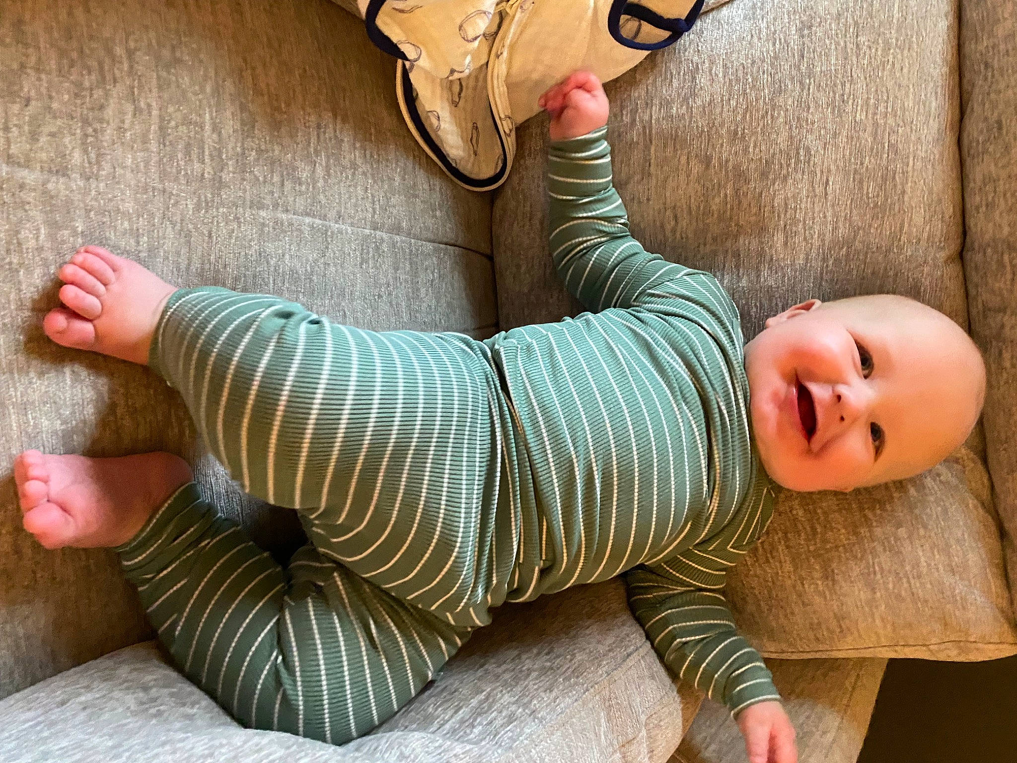 Parker is registered to the contest to win money with this photo: baby, baby_toddler_clothing, child, comfort, elbow, finger, foot, happy, hat, headgear, human_leg, joint, joy, knee, leg, person, skin, sleeve, smile, thigh