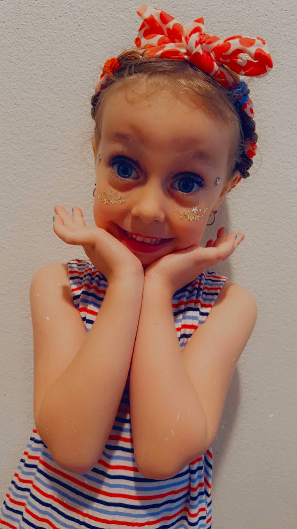 Layla is registered to the contest to win money with this photo: arm, baby_toddler_clothing, cheek, ear, electric_blue, eye, eyelash, face, gesture, happy, headpiece, iris, joy, lip, nail, neck, nose, person, shoulder, skin
