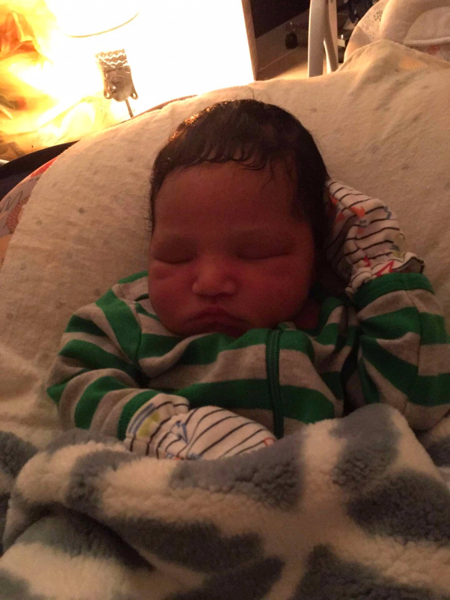 Kendrick is registered to the contest to win money with this photo: baby, bedding, bedtime, cheek, child, comfort, eyebrow, fire, fur, head, lamp, linens, mouth, nap, nose, person, room, skin, sleep, toddler