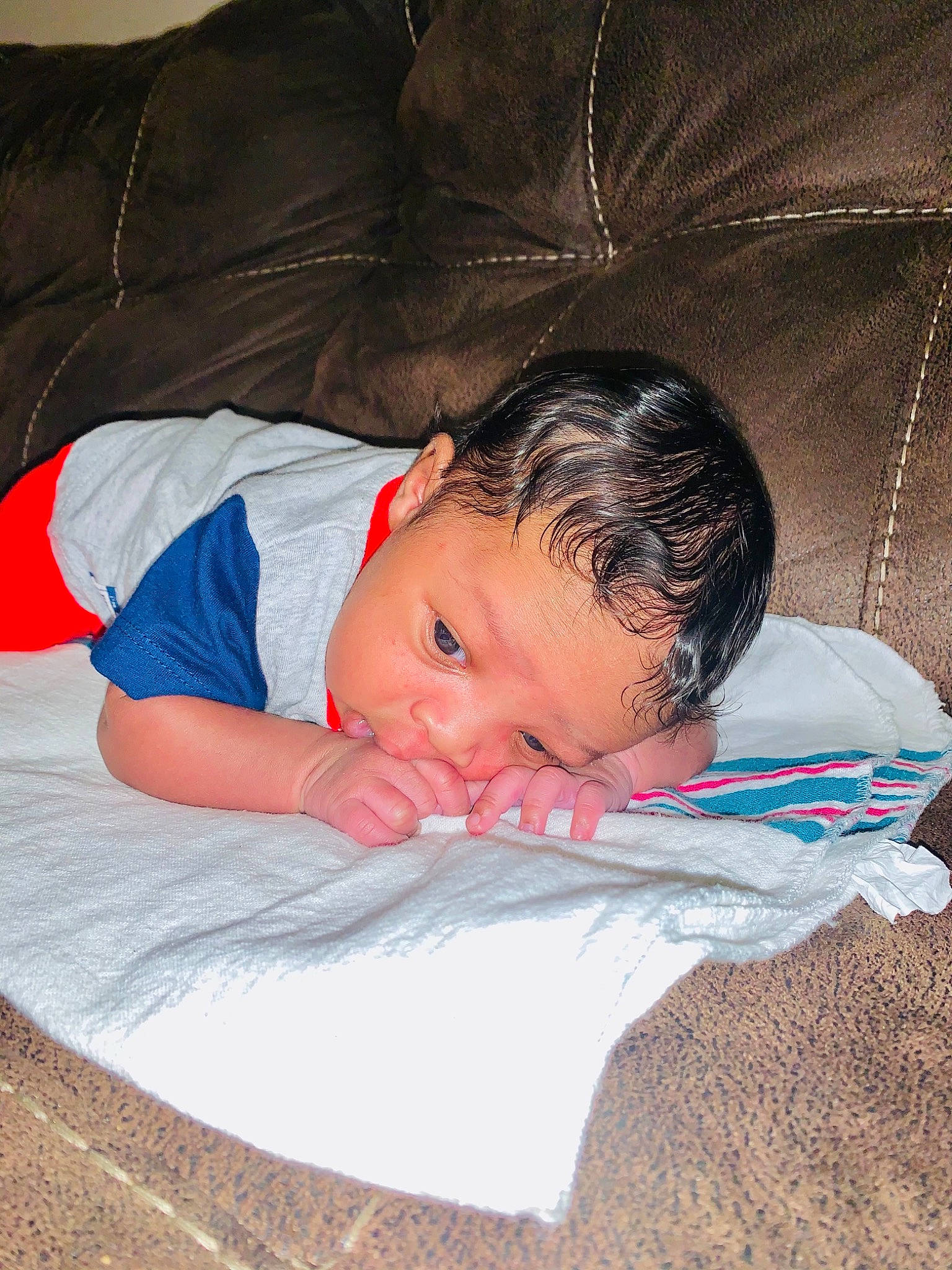 Torrence is registered to the contest to win money with this photo: baby, baby_toddler_clothing, bedding, bedtime, carmine, cheek, child, comfort, electric_blue, lap, linens, nap, pattern, person, room, sitting, sleep, sleeve, textile, toddler