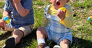 Damion is registered to the contest to win money with this photo: baby, child, toddler, grass, outdoor, easter_eggs, colorful, playing, sitting, sunlight, happy, curious, clothing, shoes, nature, spring, festival, event, fun, people