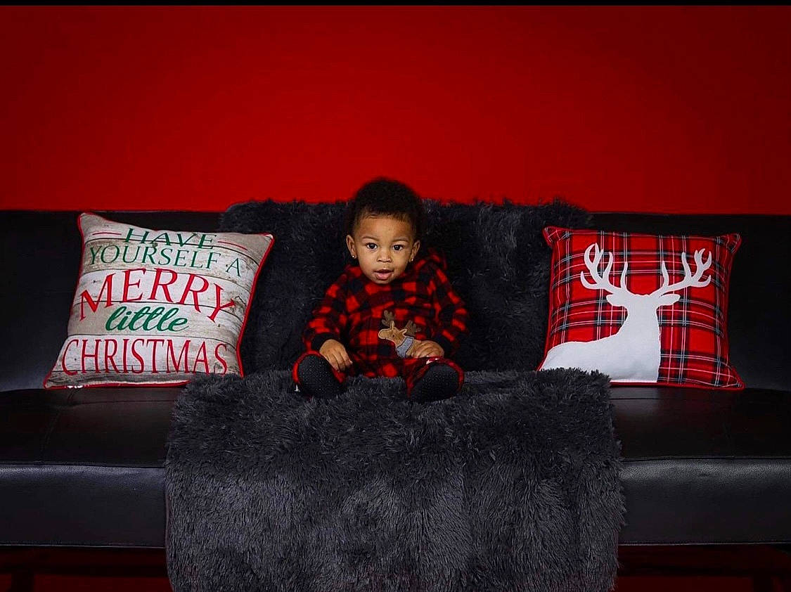 Jayce joined the competition — help win amazing prizes! carmine, comfort, couch, darkness, flash_photography, flooring, font, furniture, linens, living_room, magenta, person, pillow, rectangle, room, sitting, sofa_bed, studio_couch, throw_pillow, tints_and_shades