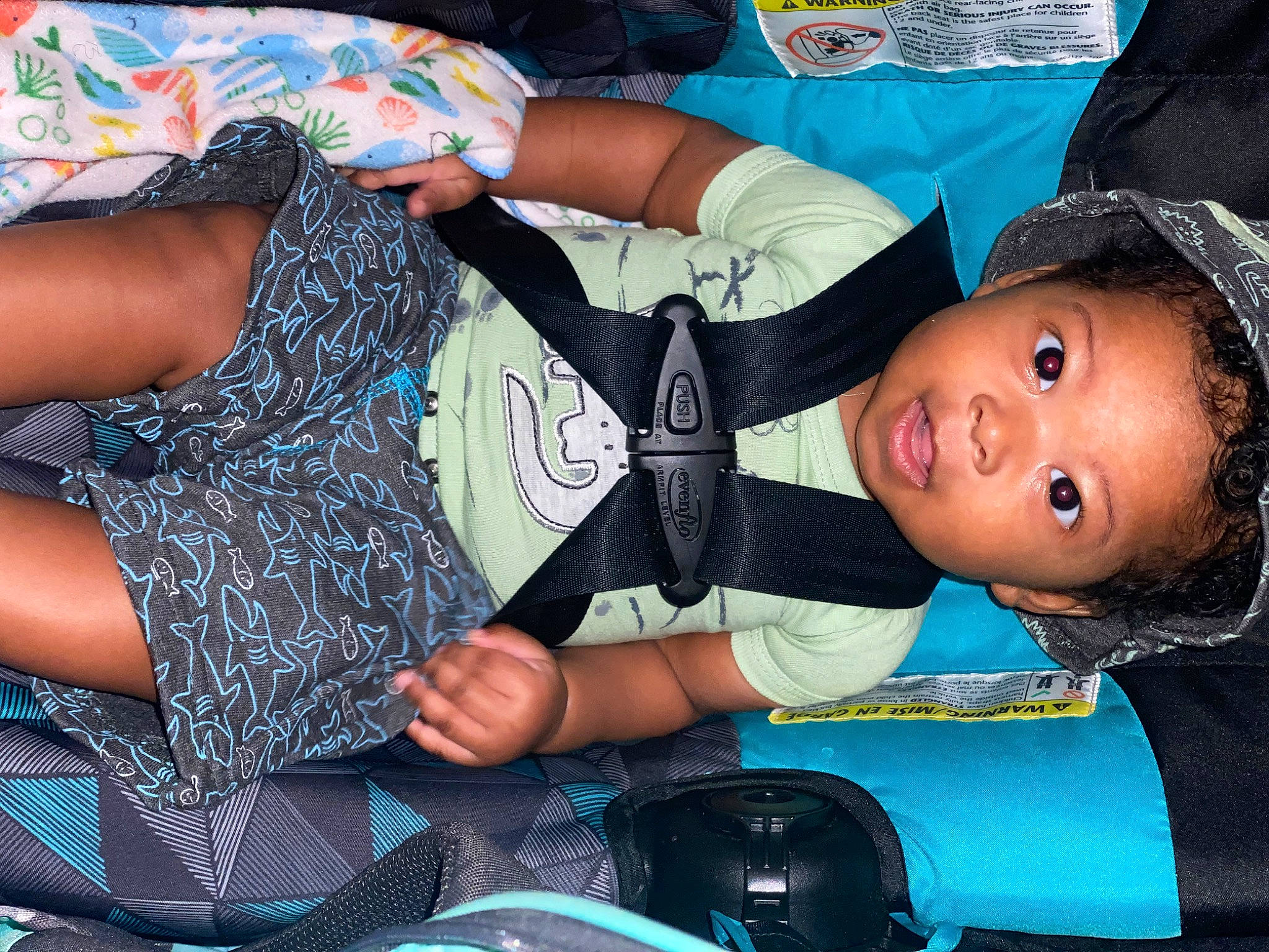 Drue is registered to the contest to win money with this photo: blue, child, comfort, elbow, electric_blue, fashion_accessory, fun, happy, human_leg, joint, knee, lap, nail, pattern, person, sitting, sleeve, thigh, toddler, waist