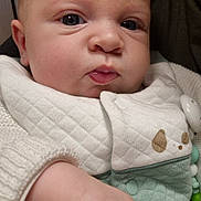 Matia participe au concours pour gagner de l'argent avec cette photo : baby, infant, face, hand, clothing, quilted, cute, person, portrait, indoors, closeup, soft, young, skin, expression, apparel, warm, comfort, child, holding