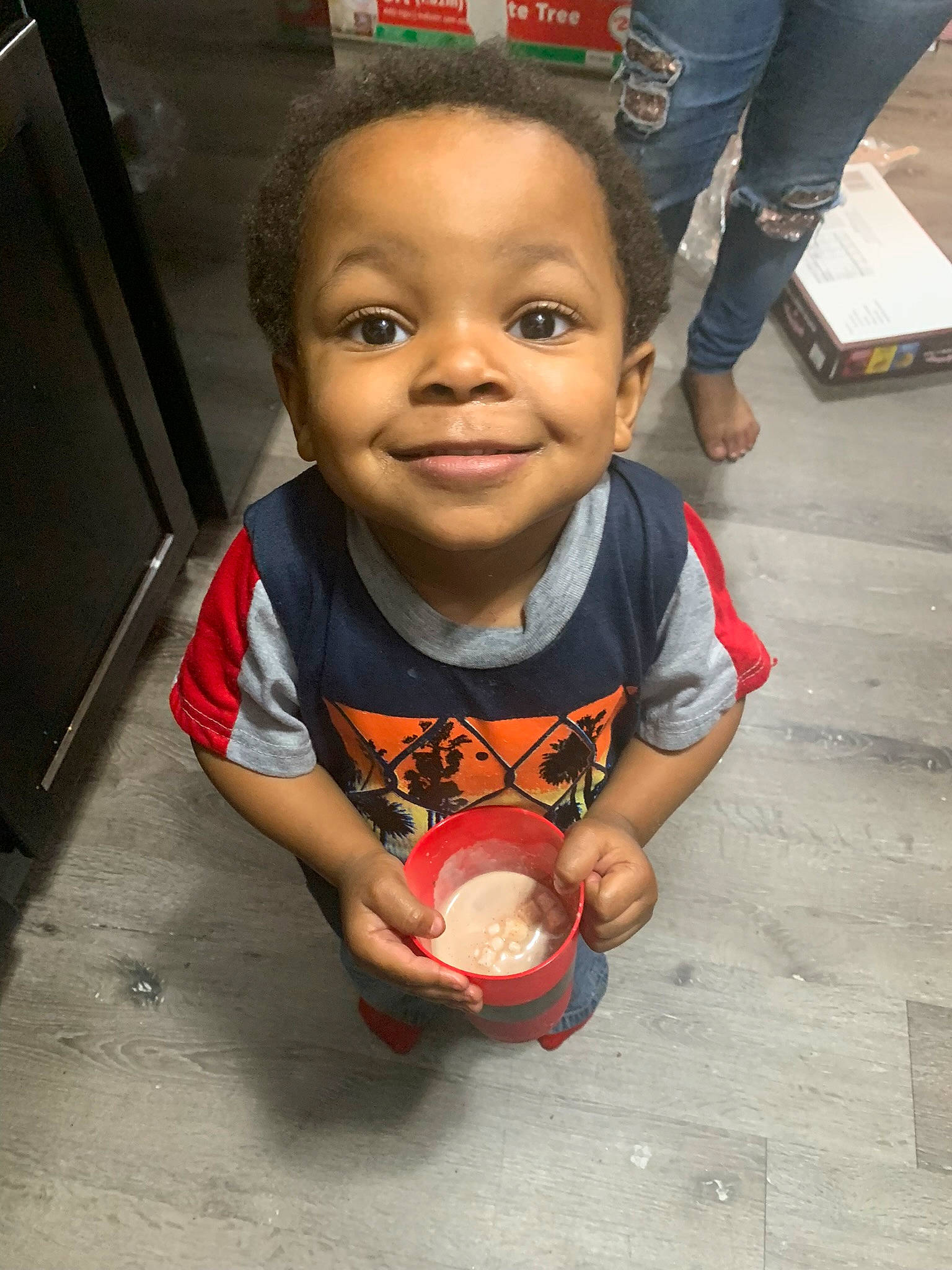 Jamier is registered to the contest to win money with this photo: baby, baby_toddler_clothing, carmine, cheek, child, face, flooring, foot, fun, happy, human_leg, joy, person, play, sitting, smile, thumb, toddler
