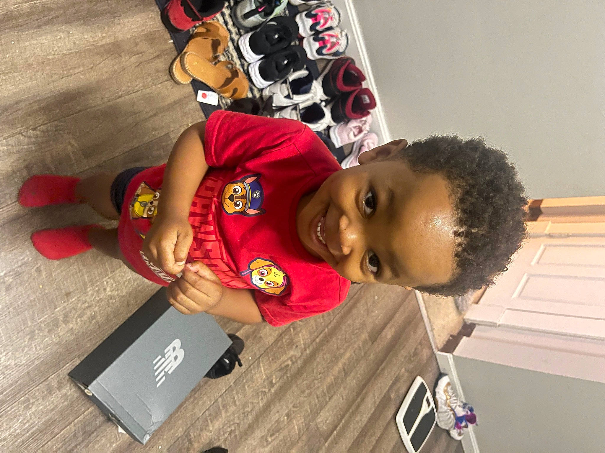 Jamier is registered to the contest to win money with this photo: box, carmine, child, elbow, fun, happy, joy, person, play, room, sleeve, t_shirt, toddler