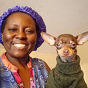 Nala joined the competition — help win amazing prizes! animal, bonnet, chihuahua, clothing, cute, dog, face, friendship, happy, head, holding, human, indoor, person, pet, portrait, small_dog, smiling, sweater, warm_clothing