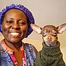 animal, bonnet, chihuahua, clothing, cute, dog, face, friendship, happy, head, holding, human, indoor, person, pet, portrait, small_dog, smiling, sweater, warm_clothing
