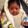 Khyaire is registered to the contest to win money with this photo: baby, blanket, bodypart, clothing, face, finger, hand, happy, head, hood, hoodie, knitwear, newborn, person, photography, portrait, smile, sweater, sweatshirt, towel