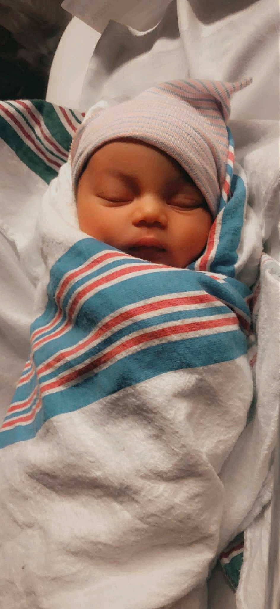 Jaylah joined the competition — help win amazing prizes! baby, baby_products, baby_safety, baby_sleeping, baby_toddler_clothing, bedtime, cap, cheek, child, comfort, happy, hat, headwear, linens, nap, pattern, person, skin, sleep, sleeve