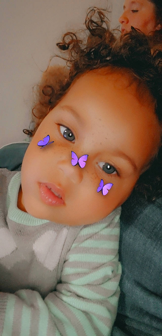 Jaylani is registered to the contest to win money with this photo: baby_toddler_clothing, brown_hair, cheek, child, close_up, electric_blue, eye, eyelash, face, fashion_accessory, forehead, happy, iris, lip, mouth, nose, person, pink, skin, toddler