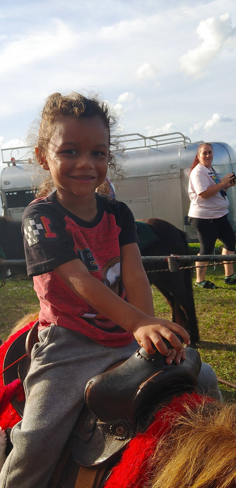 Jordan joined the competition — help win amazing prizes! child, cloud, event, fun, grass, hair, happy, joy, landscape, lap, leisure, mammal, person, recreation, shorts, sitting, sky, smile, style, t_shirt