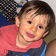 Anass participe au concours pour gagner de l'argent avec cette photo : toddler, child, smiling, face, hoodie, drool, indoor, cushion, pattern, happy, cute, portrait, baby, clothing, person, hair, eyes, skin, playful, young