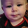 child, toddler, face, close_up, indoor, blurry, portrait, cute, cartoon_character, clothing, baby, young_child, person, head, eyebrows, eyes, mouth, hair, skin, casual