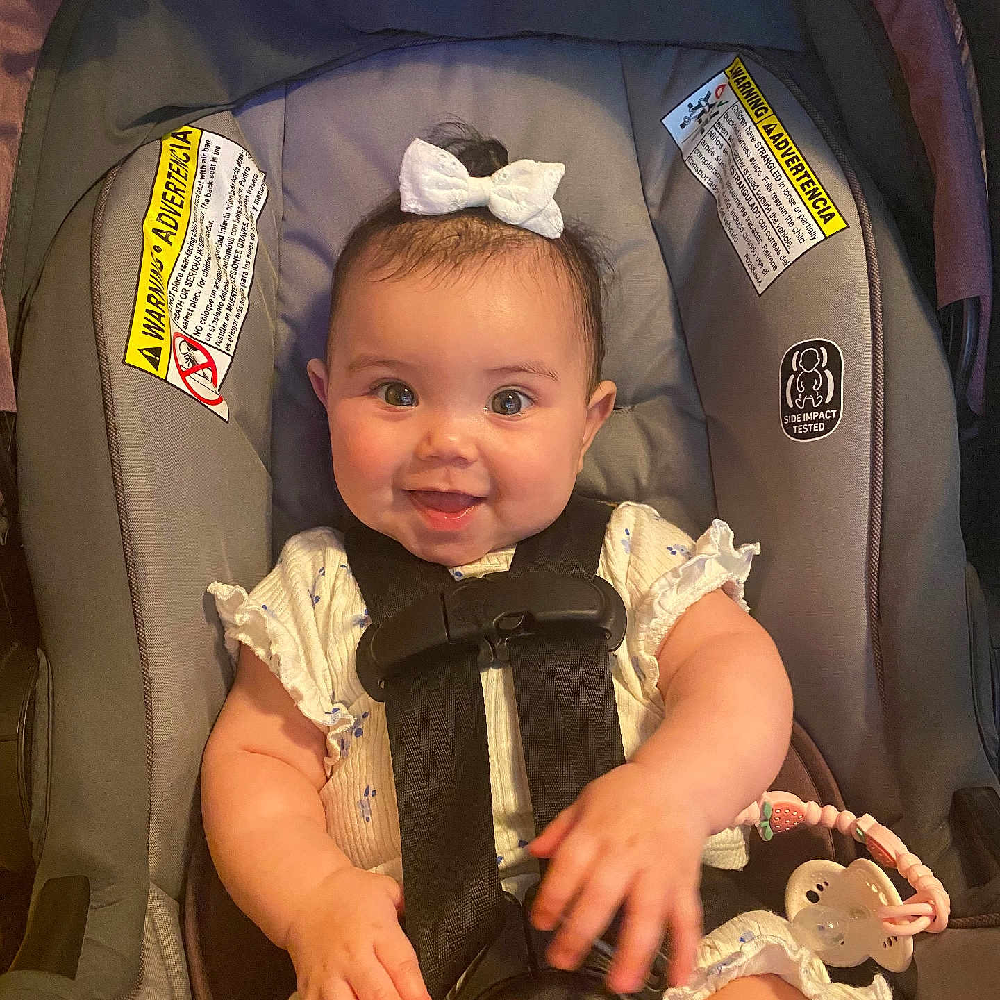Korra is registered to the contest to win money with this photo: accessories, baby, car, car_interior, carseat, clothing, coat, face, happy, head, homedecor, person, photography, portrait, smile, stroller, sunglasses, t_shirt, transportation, vehicle