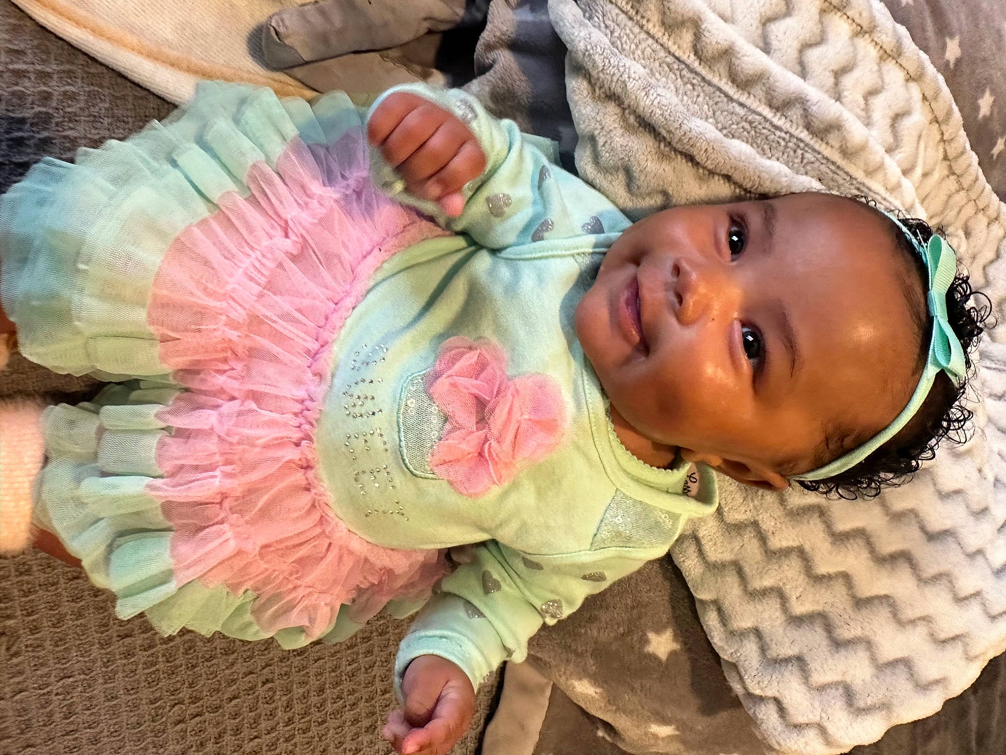 Shayden is registered to the contest to win money with this photo: baby, baby_products, baby_toddler_clothing, cheek, child, craft, eyelash, fashion_accessory, happy, joy, linens, pattern, peach, person, smile, toddler, tree, wood, wool