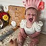 Solomia participe au concours pour gagner de l'argent avec cette photo : baby, child, flour, kitchen, chef_hat, rolling_pin, cutting_board, flowers, countertop, laughing, white_clothing, dough, wall_tiles, hand, indoors, smiling, baking, person, happy, cute