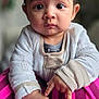 baby, child, face, eyes, hands, clothing, pink, zebra, pattern, portrait, indoor, cozy, cute, expression, sitting, person, infant, soft_focus, warm, young