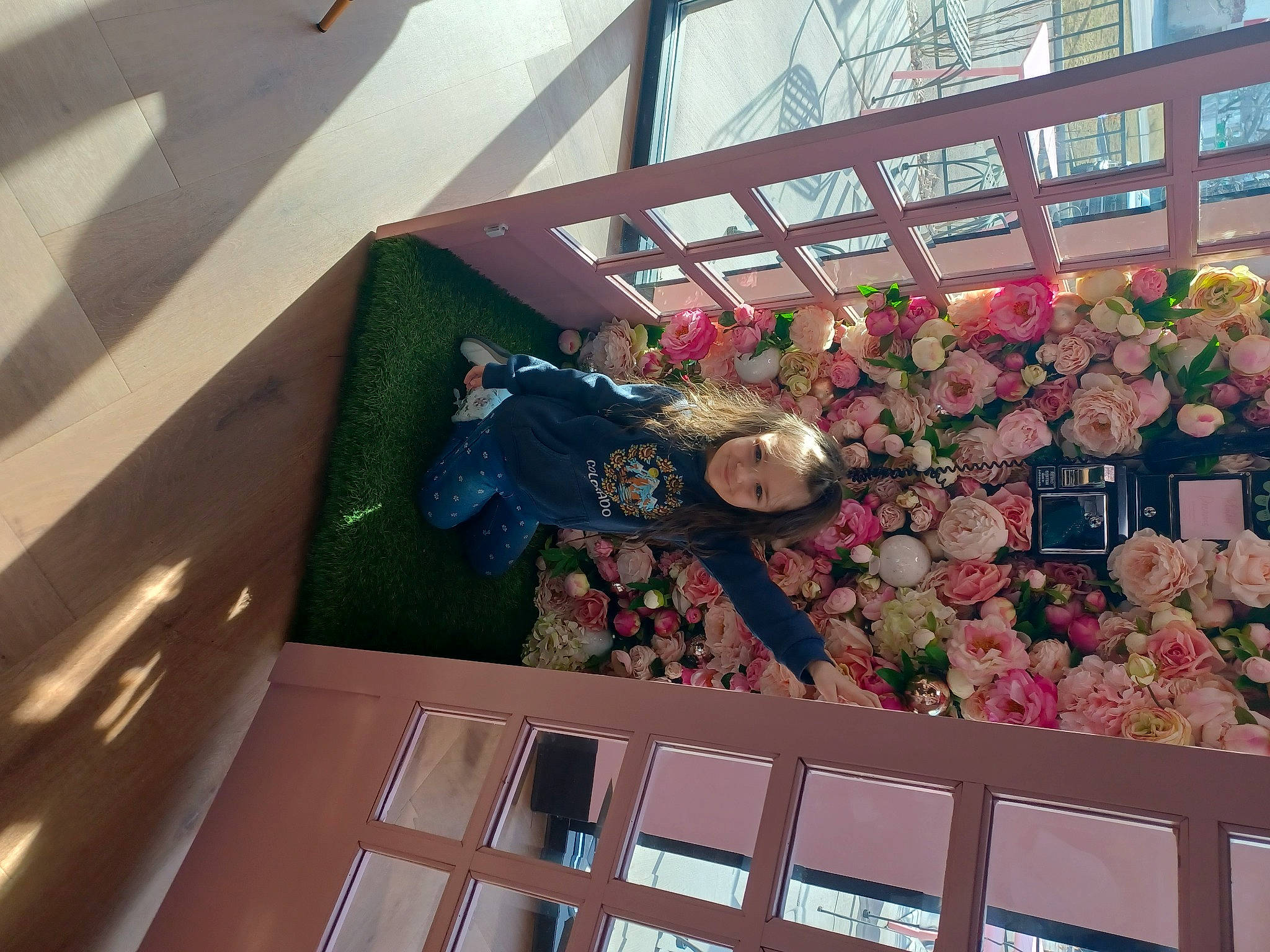 Liza is registered to the contest to win money with this photo: annual_plant, blossom, building, ceiling, flooring, floral_design, floristry, flower, glass, greenhouse, house, joy, mixed_use, peach, person, petal, plant, roof, rose, urban_design