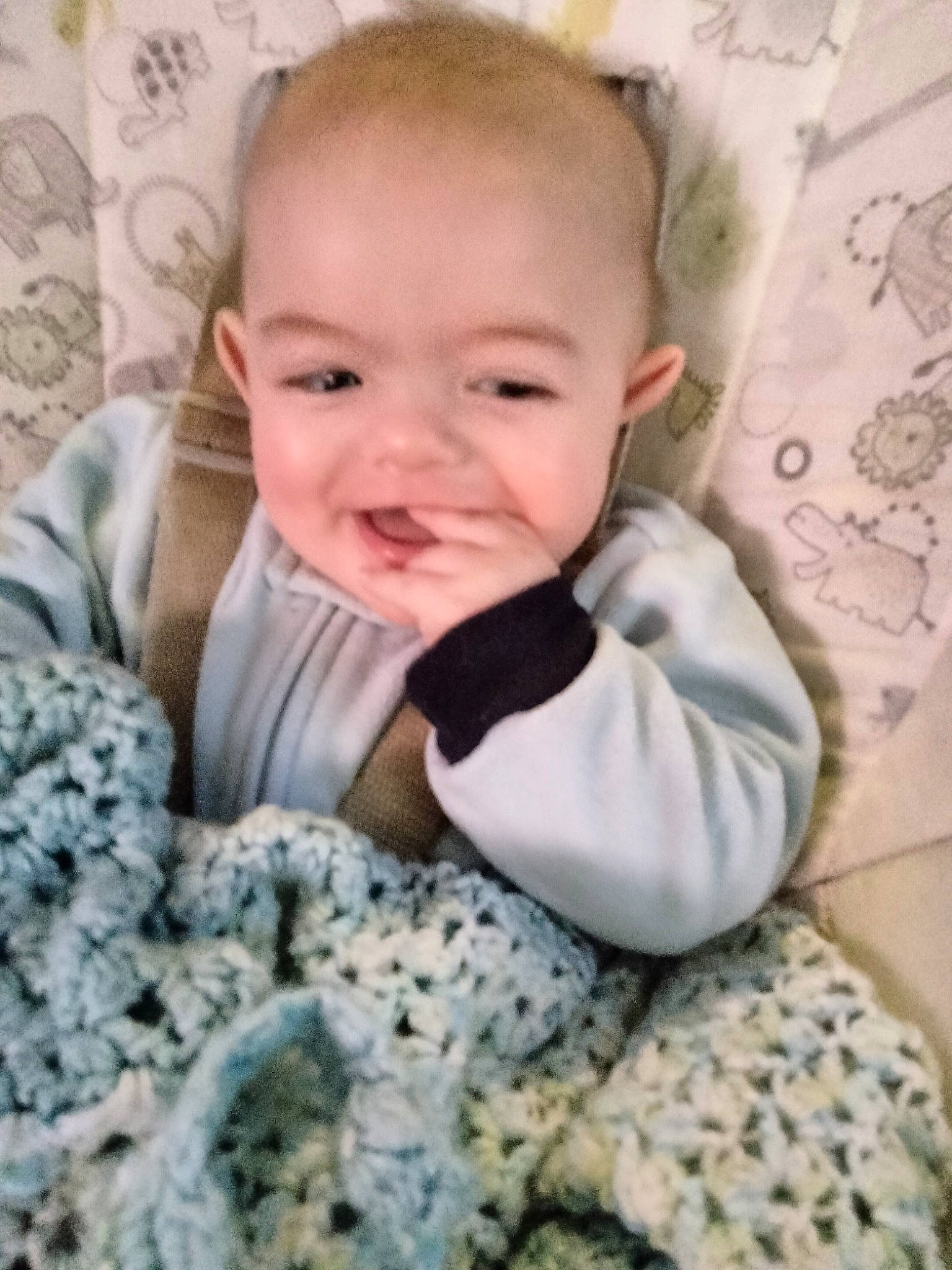 Myles is registered to the contest to win money with this photo: baby, baby_toddler_clothing, cheek, child, comfort, flooring, happy, head, iris, linens, nose, outerwear, pattern, person, product, sitting, skin, sleeve, smile, t_shirt