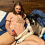 Bubba joined the competition — help win amazing prizes! affection, animal, bed, blue_blanket, bracelet, casual_clothing, crossed_legs, dog, home, human, indoor, legs, paws, pet, pink_shirt, relaxed, sitting, woman, wooden_wall, young_adult