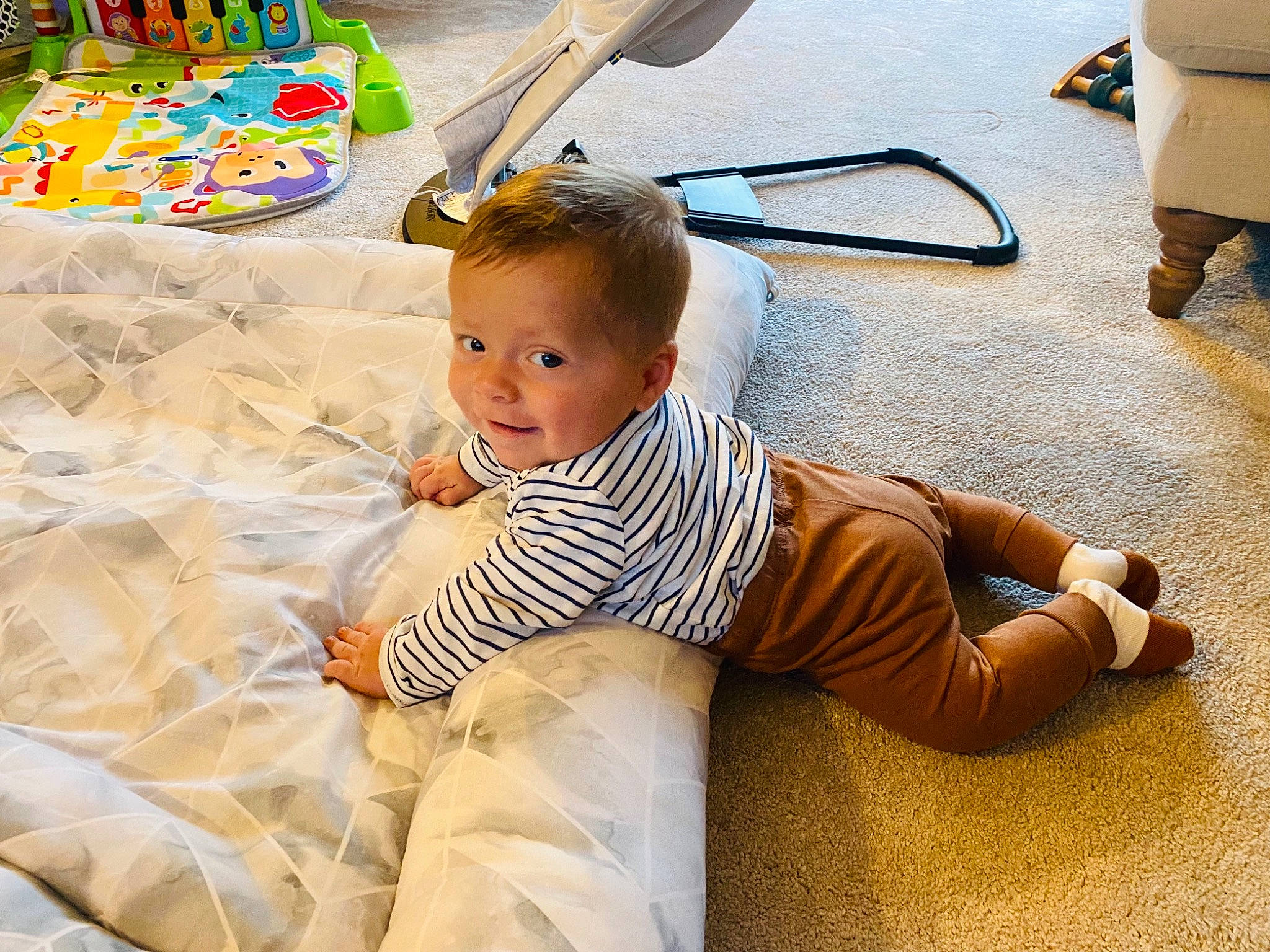 Bruno is registered to the contest to win money with this photo: baby, baby_toddler_clothing, child, comfort, face, floor, flooring, fun, happy, human_leg, leg, leisure, morning, person, photograph, product, shoe, smile, textile, toddler