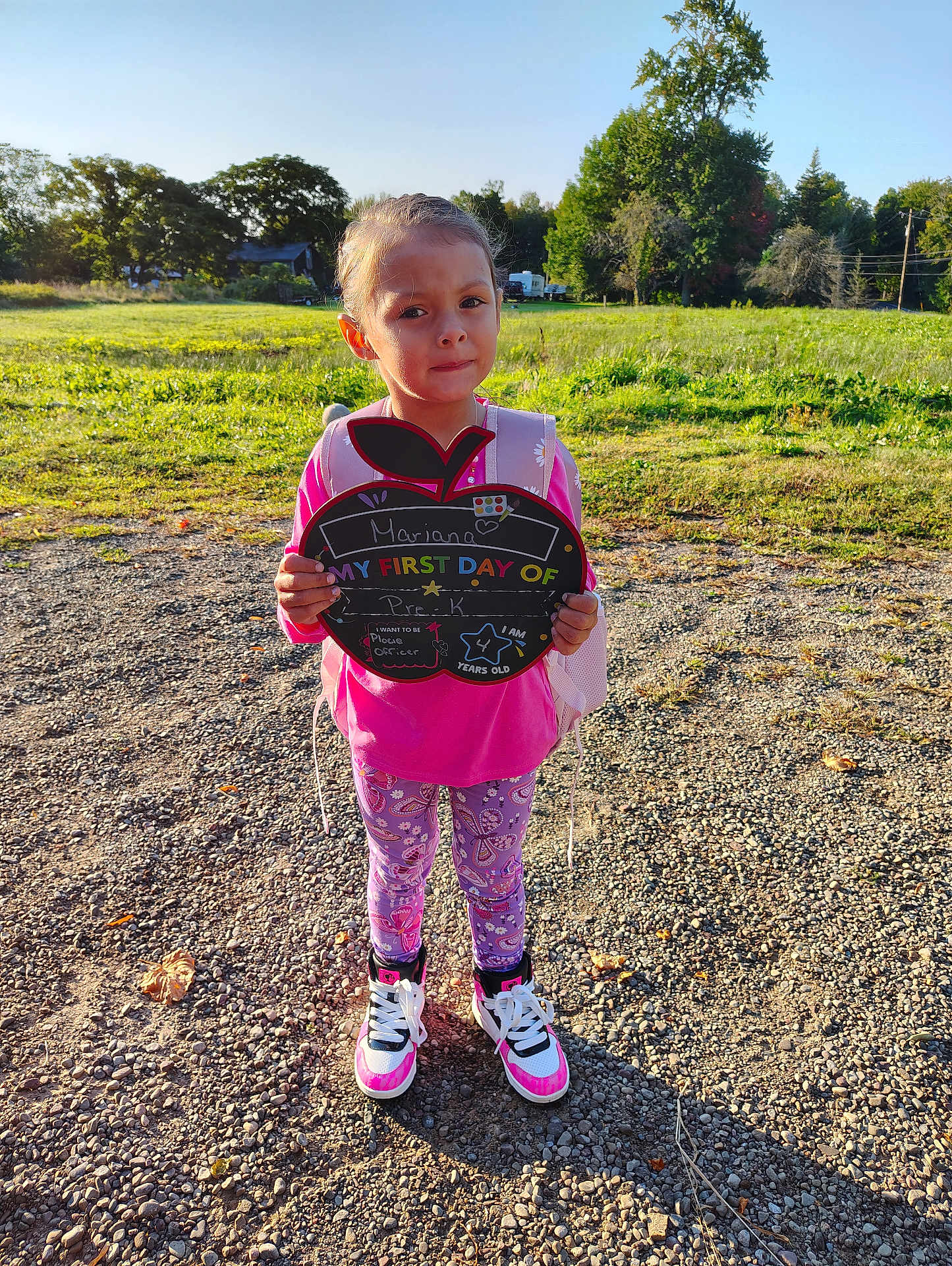 Mariana is registered to the contest to win money with this photo: child, clothing, face, female, footwear, girl, grass, head, nature, outdoors, pants, park, person, photography, plant, portrait, shoe, sneaker, soil, walking