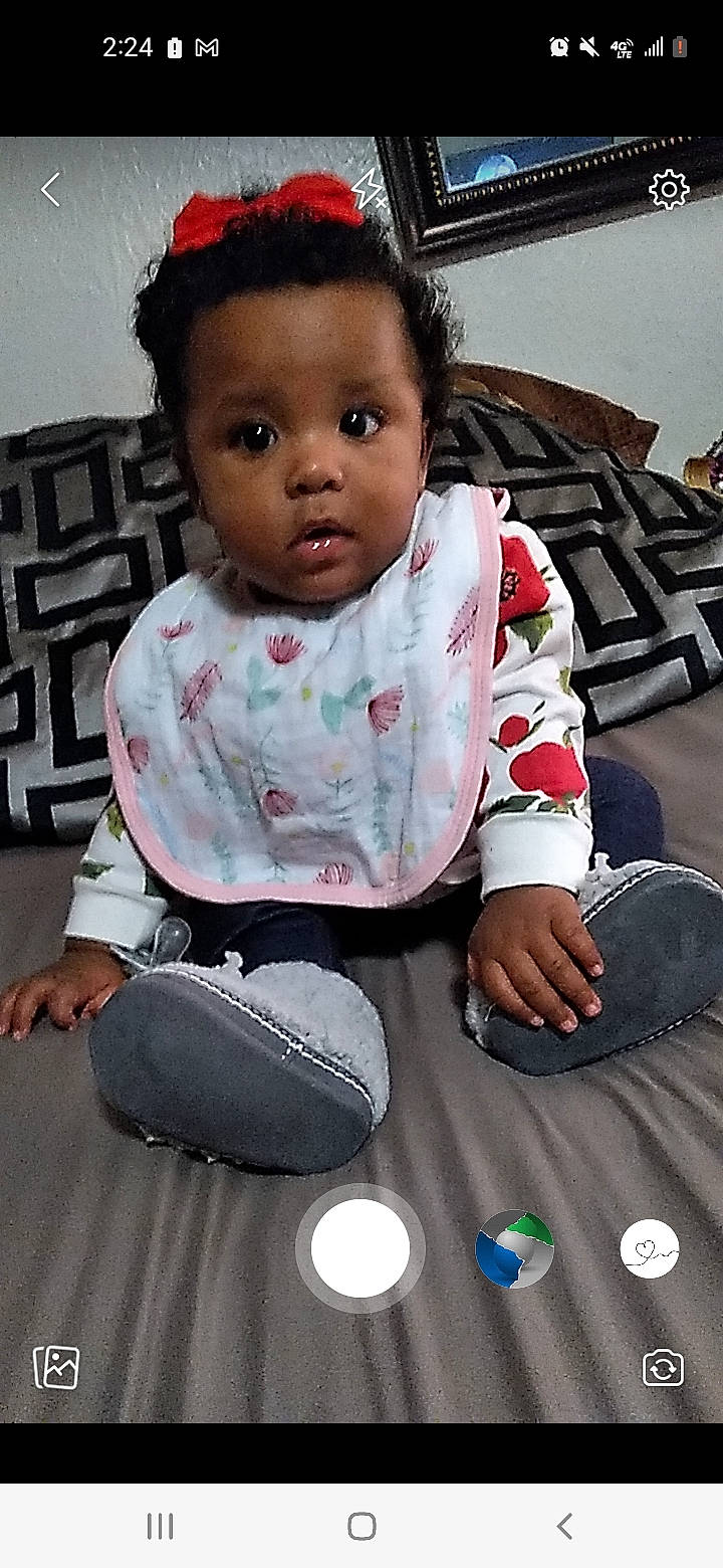 A'Niyah joined the competition — help win amazing prizes! baby, baby_toddler_clothing, black, cheek, child, eye, face, flash_photography, flooring, happy, head, human, nose, people, person, photograph, skin, sleeve, standing, toddler