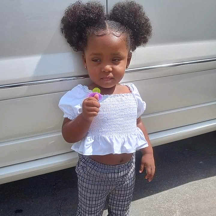 A'Niyah is registered to the contest to win money with this photo: blackhair, bodypart, clothing, cream, curlyhair, dessert, face, finger, food, hair, hand, head, icecream, person, photography, portrait, sleeve, sweets, transportation, vehicle