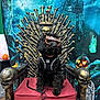 dog, black_dog, halloween, costume, sunglasses, throne, skull, bones, pumpkin, jack_o_lantern, haunted_castle, chair, red_cushion, leash, indoor, decorations, spooky, gothic, pet, celebration