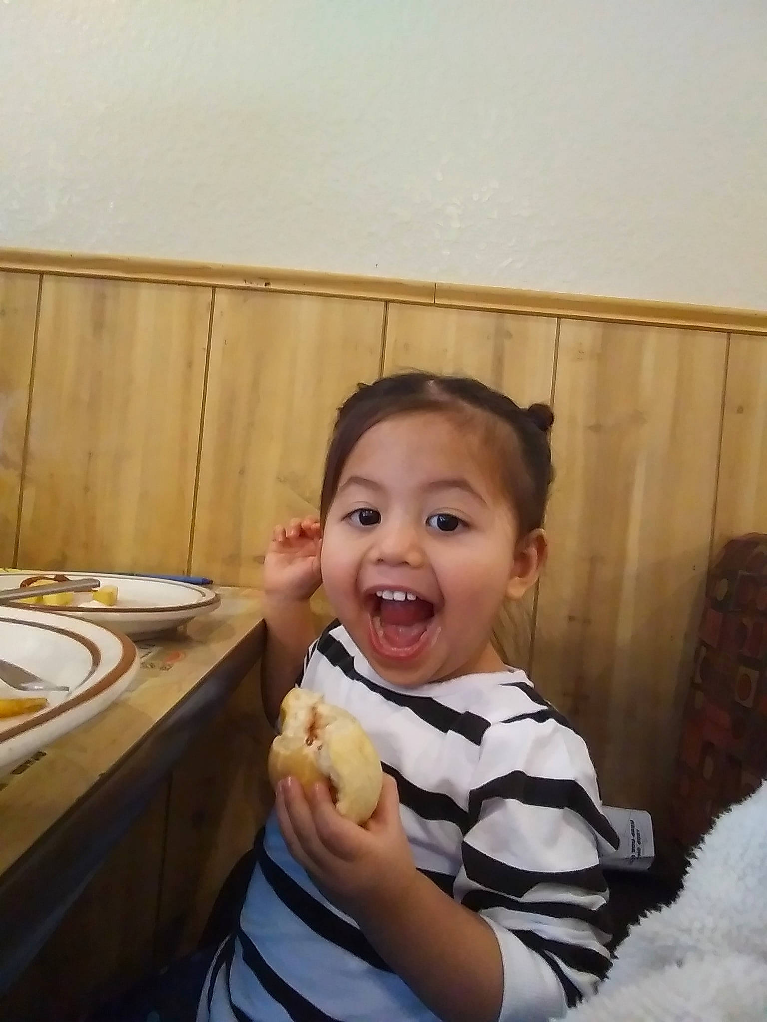 Liora is registered to the contest to win money with this photo: baby, child, comfort_food, eating, food, person, smile, thumb, toddler