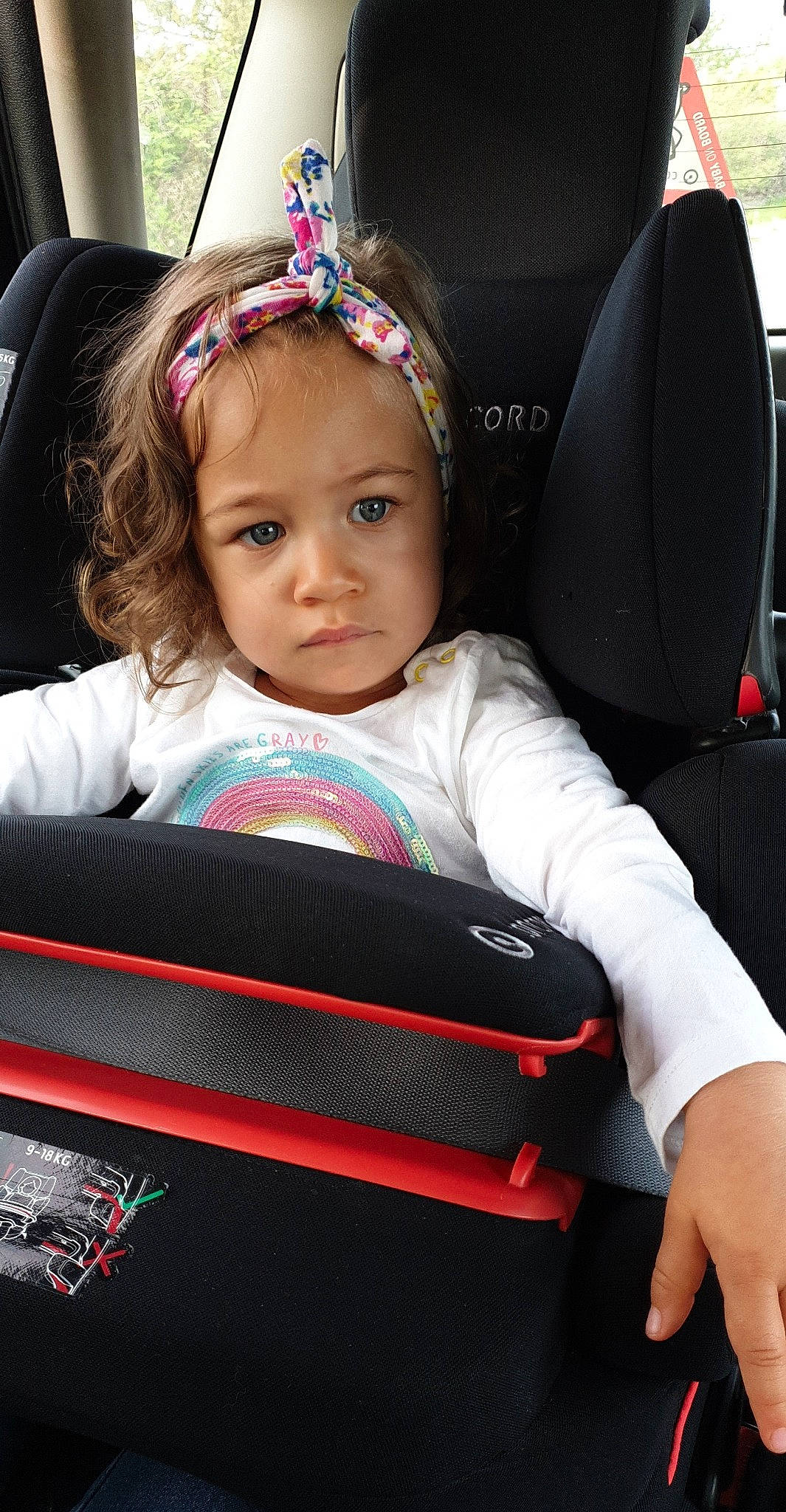 Milana participe au concours pour gagner de l'argent avec cette photo : auto_part, baby_in_car_seat, car, car_seat, car_seat_cover, child, child_model, hair_accessory, headband, person, product, seat_belt, sitting, steering_part, steering_wheel, toddler, vehicle